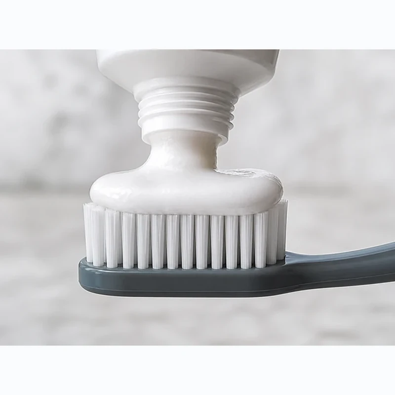 Davids toothpaste squeezed onto a charcoal toothbrush